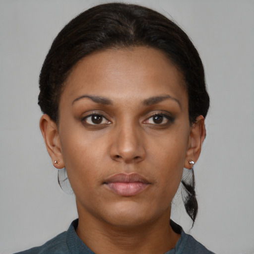 Neutral black young-adult female with short  brown hair and brown eyes
