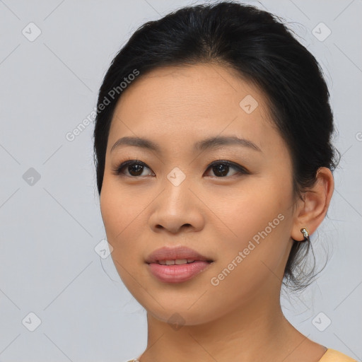 Joyful asian young-adult female with medium  black hair and brown eyes