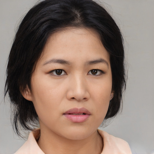 Neutral asian young-adult female with medium  brown hair and brown eyes
