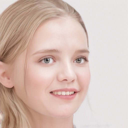 Joyful white child female with long  brown hair and blue eyes