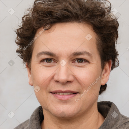 Joyful white adult female with short  brown hair and grey eyes