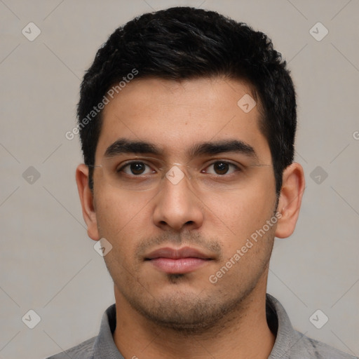 Neutral latino young-adult male with short  black hair and brown eyes
