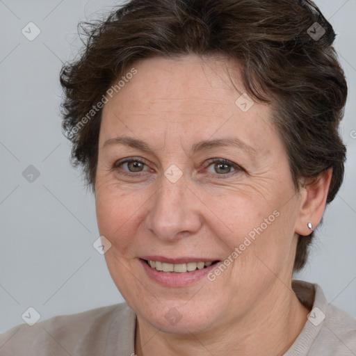 Joyful white adult female with short  brown hair and brown eyes