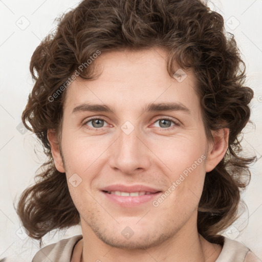 Joyful white young-adult male with medium  brown hair and brown eyes