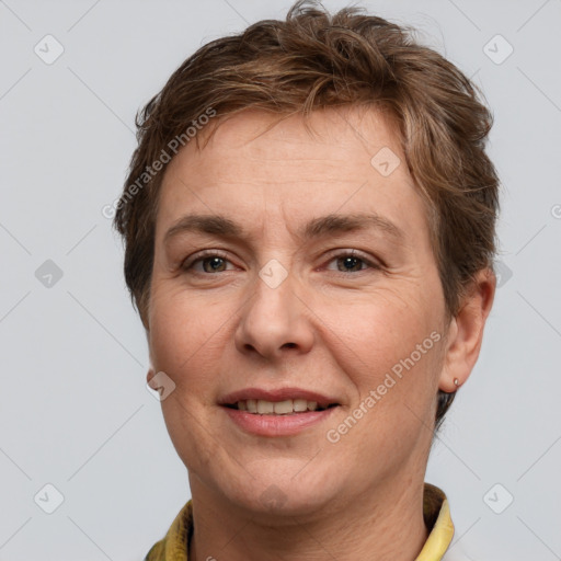 Joyful white adult female with short  brown hair and grey eyes