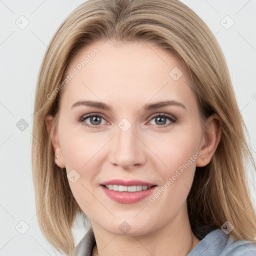 Joyful white young-adult female with long  brown hair and blue eyes