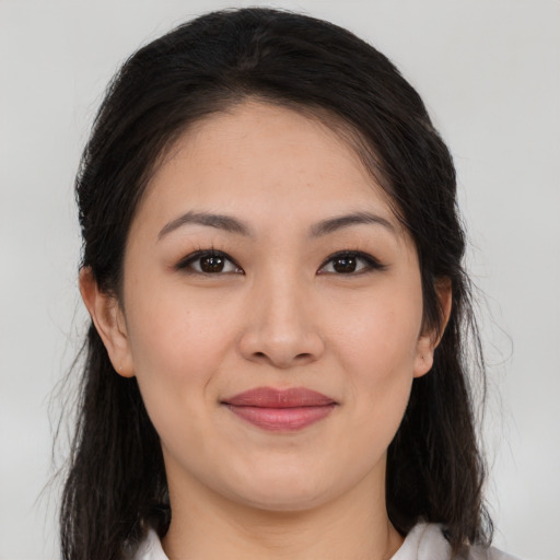 Joyful white young-adult female with medium  brown hair and brown eyes