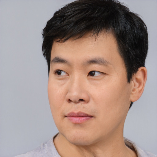 Neutral asian young-adult male with short  black hair and brown eyes