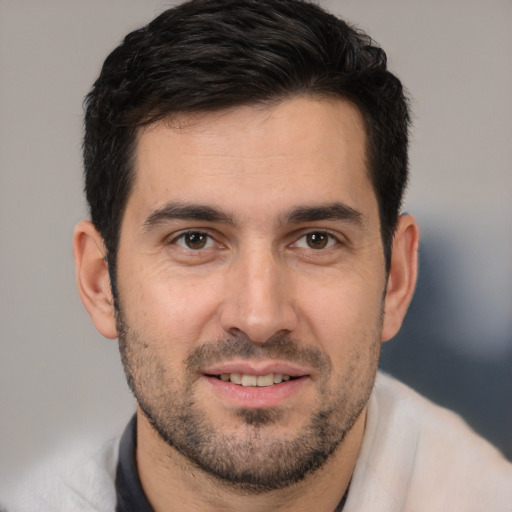 Joyful white young-adult male with short  brown hair and brown eyes