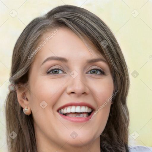 Joyful white young-adult female with long  brown hair and blue eyes