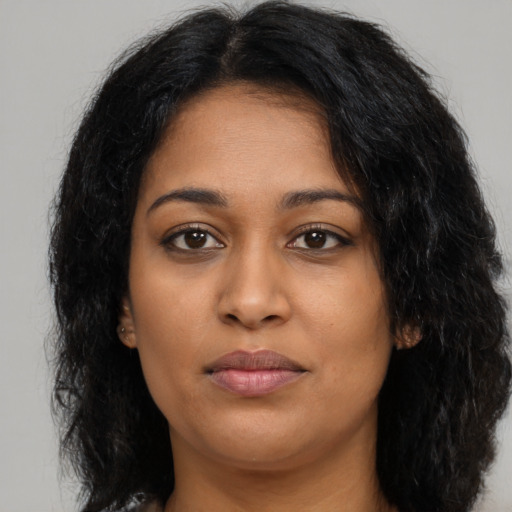 Neutral latino young-adult female with long  brown hair and brown eyes