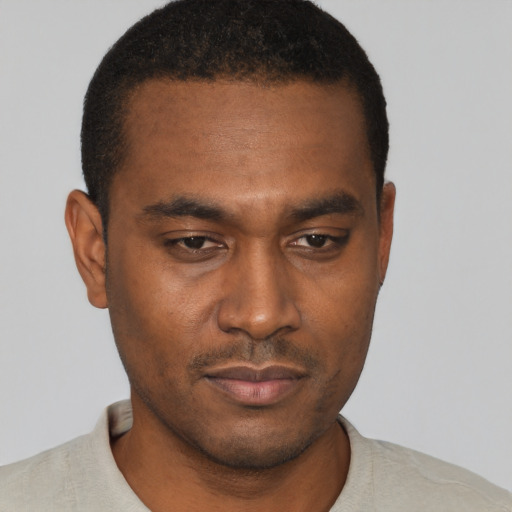 Neutral black young-adult male with short  brown hair and brown eyes