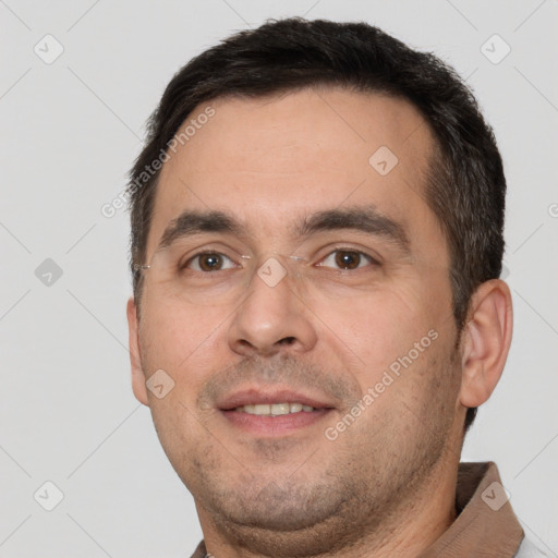 Joyful white adult male with short  brown hair and brown eyes