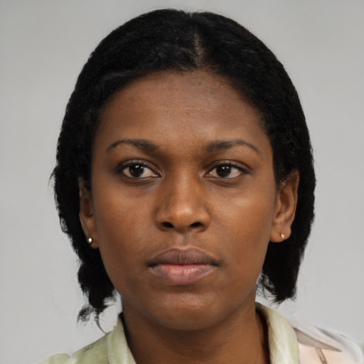 Neutral black young-adult female with medium  black hair and brown eyes
