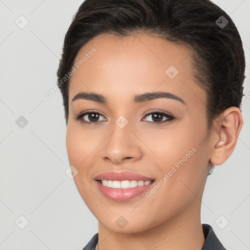 Joyful white young-adult female with long  brown hair and brown eyes