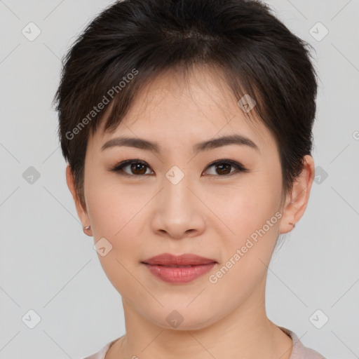 Joyful asian young-adult female with short  brown hair and brown eyes