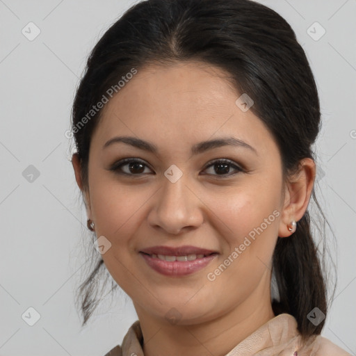 Joyful latino young-adult female with medium  brown hair and brown eyes