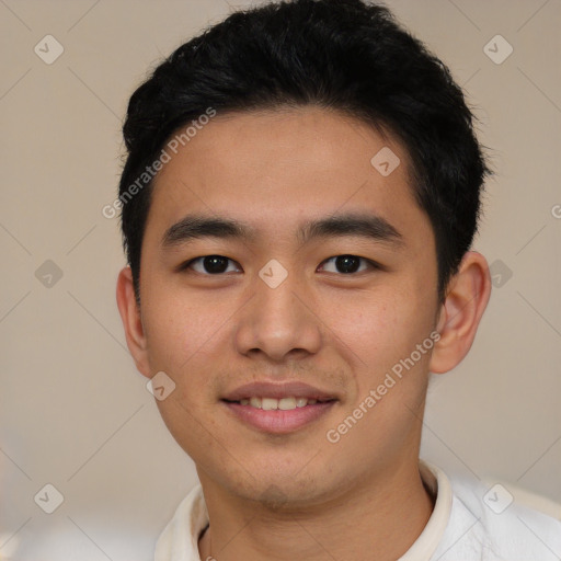 Joyful asian young-adult male with short  black hair and brown eyes