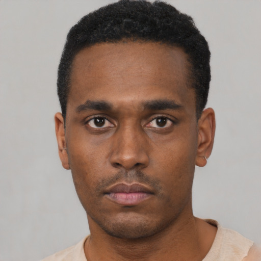Neutral black young-adult male with short  black hair and brown eyes