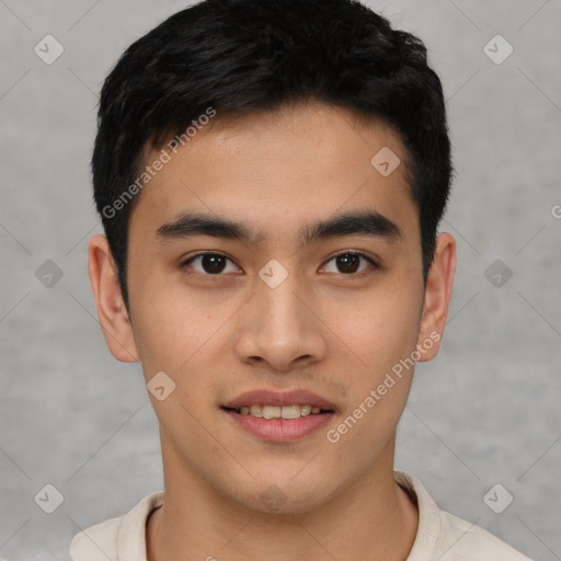 Joyful asian young-adult male with short  black hair and brown eyes