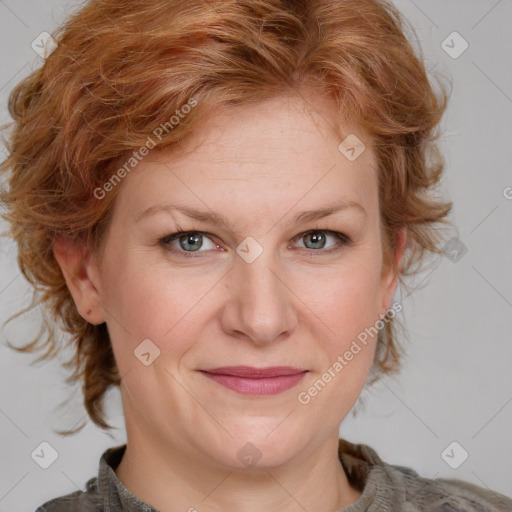 Joyful white adult female with medium  brown hair and blue eyes