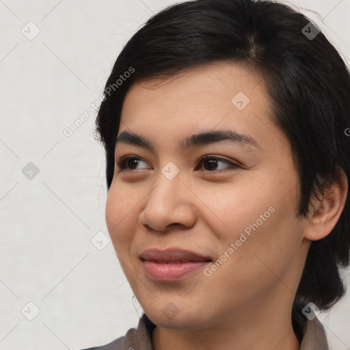 Joyful asian young-adult female with medium  brown hair and brown eyes