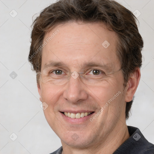 Joyful white adult male with short  brown hair and grey eyes