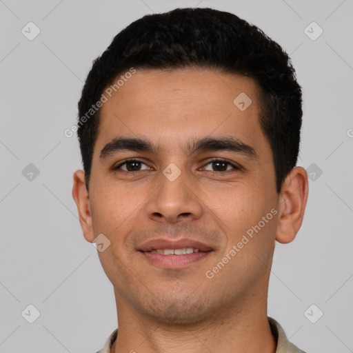 Joyful latino young-adult male with short  black hair and brown eyes