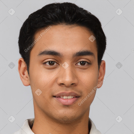 Joyful latino young-adult male with short  black hair and brown eyes