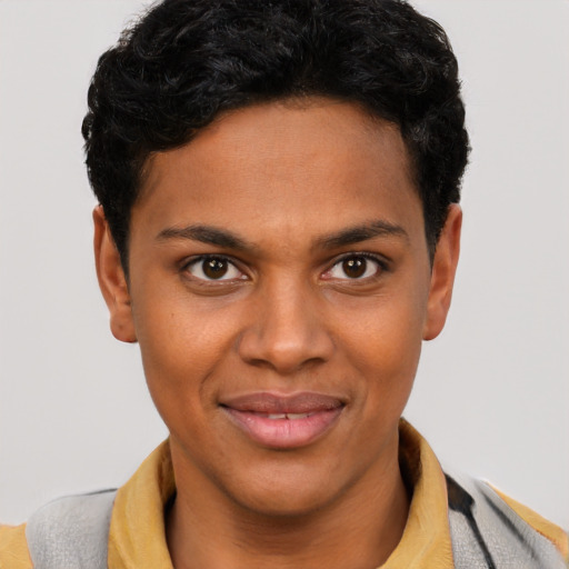 Joyful black young-adult female with short  brown hair and brown eyes