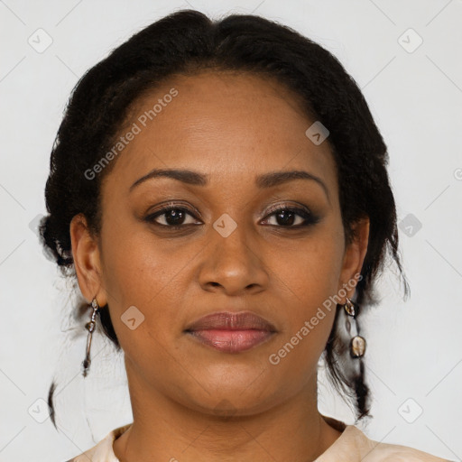 Joyful black adult female with medium  brown hair and brown eyes