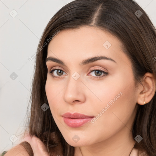 Neutral white young-adult female with long  brown hair and brown eyes