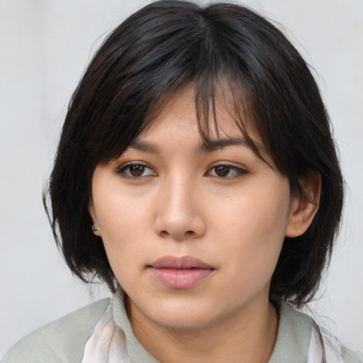 Neutral asian young-adult female with medium  brown hair and brown eyes