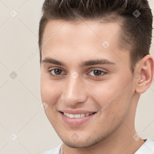 Joyful white young-adult male with short  brown hair and brown eyes