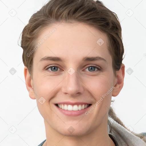 Joyful white young-adult female with short  brown hair and grey eyes