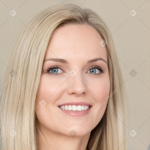 Joyful white young-adult female with long  brown hair and blue eyes