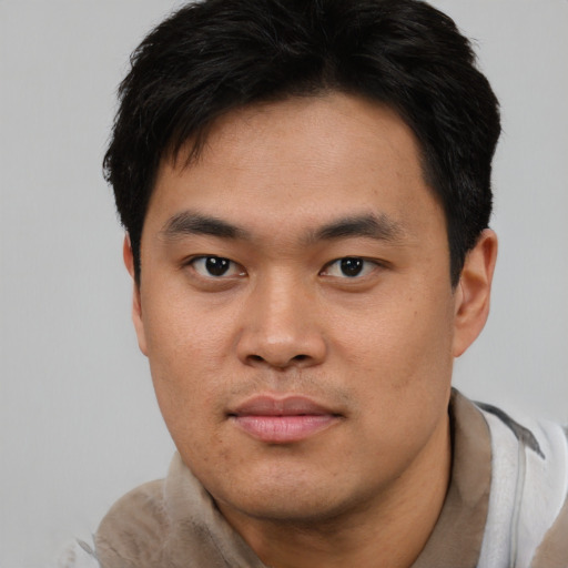 Neutral asian young-adult male with short  black hair and brown eyes