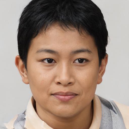 Joyful asian young-adult female with short  brown hair and brown eyes