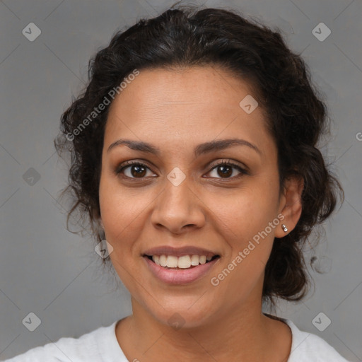 Joyful latino adult female with medium  brown hair and brown eyes