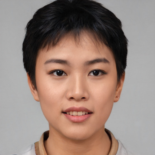 Joyful asian young-adult female with short  black hair and brown eyes