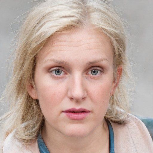 Joyful white young-adult female with medium  blond hair and blue eyes