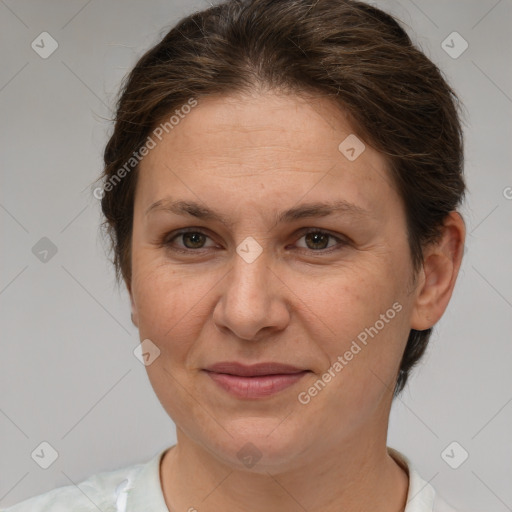 Joyful white adult female with short  brown hair and brown eyes