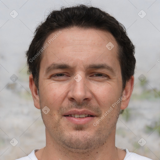 Joyful white adult male with short  brown hair and brown eyes