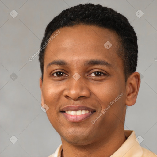 Joyful latino young-adult male with short  black hair and brown eyes