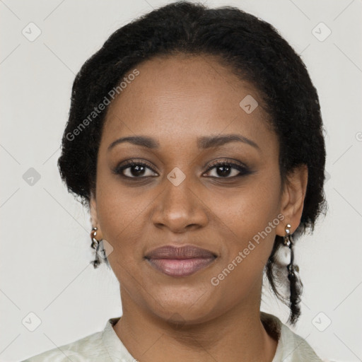 Joyful black adult female with medium  brown hair and brown eyes