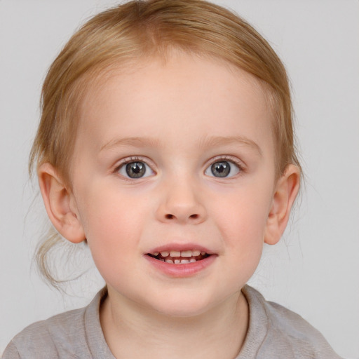 Joyful white child female with medium  brown hair and blue eyes