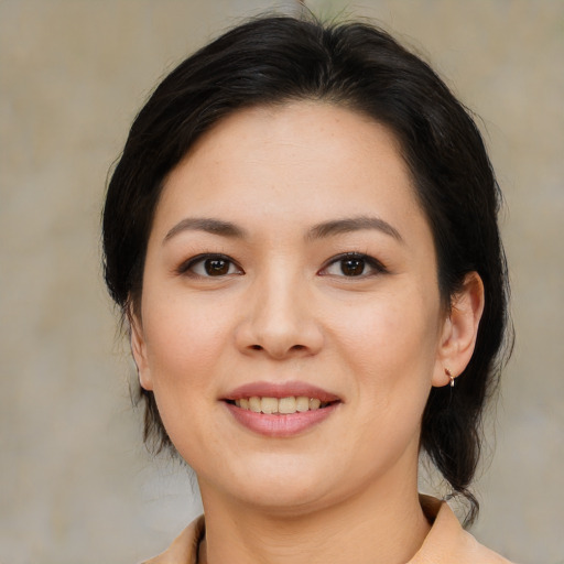 Joyful asian young-adult female with medium  brown hair and brown eyes
