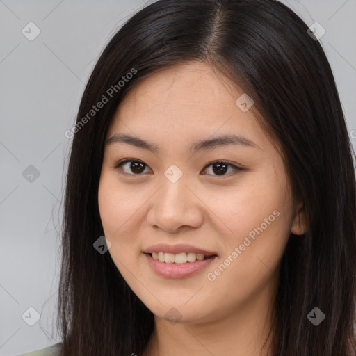 Joyful asian young-adult female with long  brown hair and brown eyes