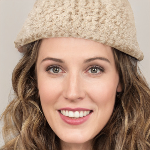 Joyful white young-adult female with long  brown hair and green eyes