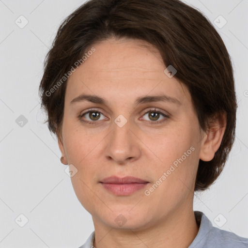 Joyful white adult female with short  brown hair and grey eyes